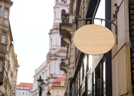 Empty wooden signboard on a european street. Architectural detail close-up ready for your textの写真素材