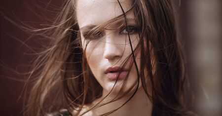 Portrait of Fashion Model Girl on the Industrial Background. Background of Metal Texture. Style Fashion of Grunge, Brutal, Gothic.の写真素材