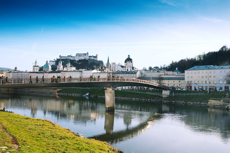 SALBURG, AUSTRIA - DECEMBER 25: People walking on a bridge above river Salzach in the famous city of Salzburg in Austria on December 25, 2015 in Salzburg, Austria. Christmas in Europe.のeditorial素材
