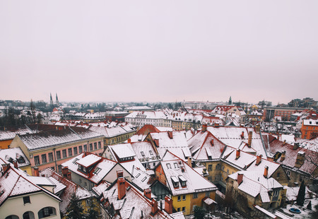Atmospheric Real Winter Panoramic View of Ljubljana from Castle on the Snowy Red Roofs.の写真素材