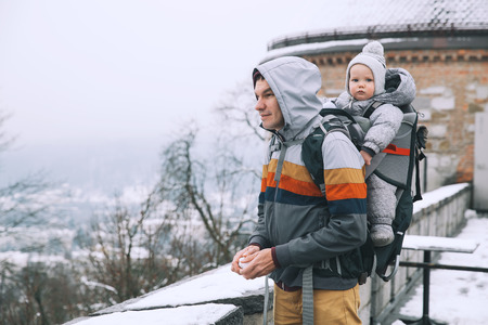 Family walking in Ljubljana, Slovenia at winter time. Family background. Parent and child together.の写真素材