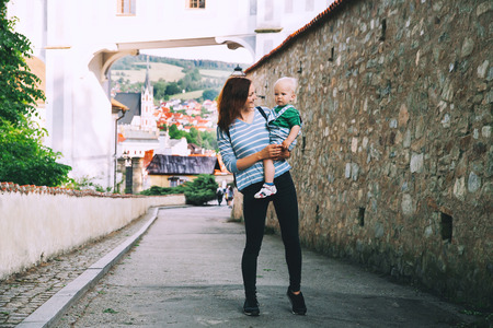 Family of Tourists on medieval street in old Town of Cesky Krumlov, Czech Republic. Springtime or Summer in Europe. Travel and Holidayの写真素材