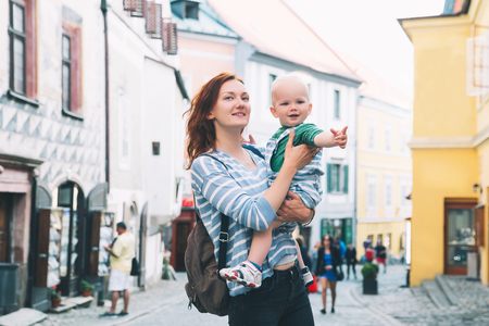 Family of Tourists on medieval street in old Town of Cesky Krumlov, Czech Republic. Springtime or Summer in Europe. Travel and Holidayの写真素材