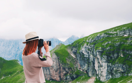Traveler or hiker in the mountains. Mangart is a mountain in the Julian Alps, located between Italy and Slovenia. Travel, Freedom, Lifestyle concept.の写真素材