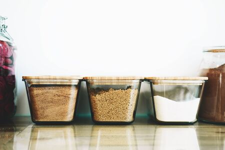 Bio organic dry goods and some sweets food in glass jars in sustainable plastic free grocery store. Eco-friendly zero waste shop. Image of shopping at small businesses. New trend alternative buyingの写真素材