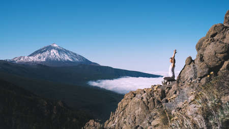 Image of yoga inspiration on nature. Young woman with yoga mat gets ready to practicing yoga...