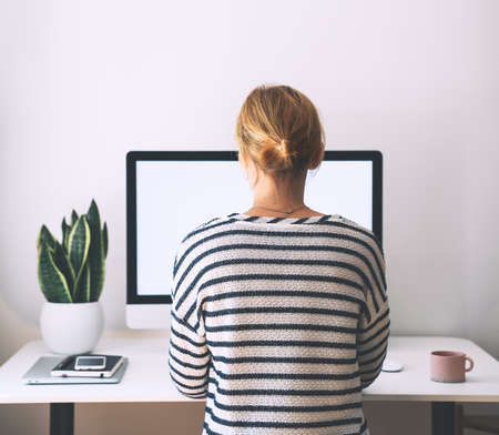 Woman freelancer working at home office. Girl wearing in glasses works with new startup project....