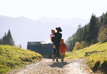 Beautiful happy family enjoying vacations in countryside. Mother and child together in nature...