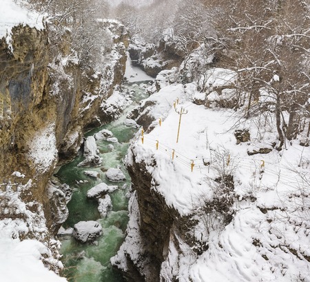 KAMENNOMOSTSKIY, ADYGEYA, RUSSIA - January 29.2017: Equipped with a reliable protection system guided tour on the territory of the hadzhohskaya tasnina canyon, a scenic gorge of the White riverのeditorial素材