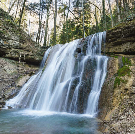 Kaverinsky a Large flowing waterfall in a remote gorge of the mountains. Hiking route. Russia, North Caucasusの写真素材