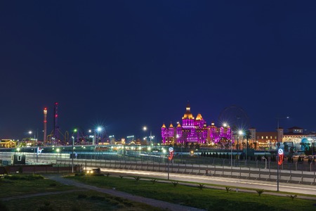 Sochi, Krasnodar Krai, Russia - June 06.2017: Beautiful evening illumination entertainment Sochi Park, hotel "Bogatyr". The view from the peace settlementのeditorial素材
