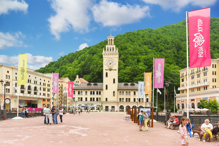 Estosadok, Sochi, Russia - June 10.2017: the Main attraction of the ski resort "Rosa Khutor" - the town hall clock on the "Square rose" summer cloudy dayのeditorial素材