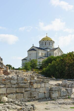 Golden domes of the Orthodox Vladimir Cathedral in Chersonesos, on the background of blue sky. Sunny dayの写真素材