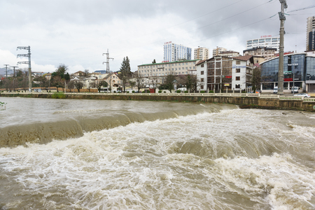 Russia, Krasnodar region, Sochi - March 08.2018: the City on the banks of the muddy and rough after rain the river Sochiのeditorial素材