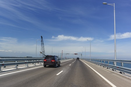 Cars driving on the Tuzla spit on the Taman Peninsula. Crimean bridge. May 2018のeditorial素材