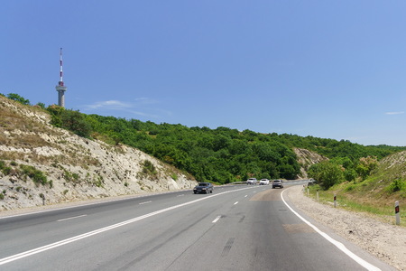 A-290 Novorossiysk-Kerch is a road of Federal importance in Russia. On the left you can see the third highest in Russia Novorossiysk television stationの写真素材