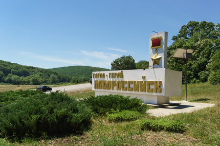 Russia, Krasnodar region, Federal highway A146 "Krasnodar - Verkhnebakansky" - June 12, 2018: Stele on the side of the road with the inscription in Russian " hero-City of Novorossiysk"のeditorial素材