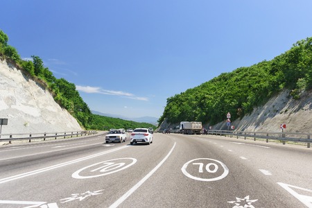 Russia, Krasnodar region, Novorossiysk-June 12, 2018: The markup on the automobile road of Federal significance of the Russian ?290 Novorossiysk-Kerch: the speed limit. Sunny summer dayのeditorial素材