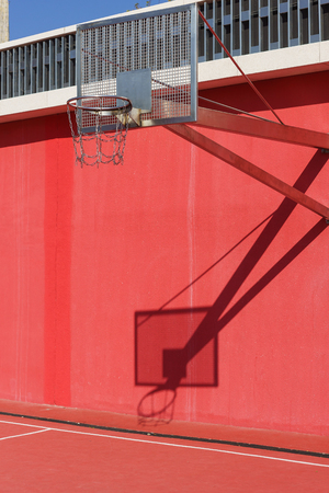 Metal basket for street basketball in the city Park of culture and recreation Krasnodar. Bright red wallの写真素材