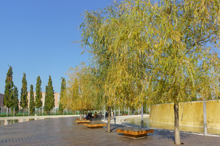 Krasnodar, Russia-October 19, 2018: a place to relax near a small man-made waterfall in the new city Park Krasnodar near the stadium of the football club of the same name. Sunny autumn dayのeditorial素材