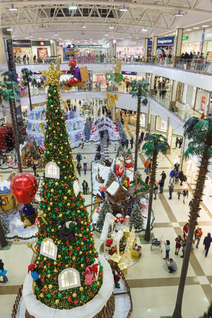 Russia, Krasnodar-January 07, 2017: new year tree and fairy-tale characters in the Central hall of the shopping and entertainment complex Red Square. Time to buy giftsのeditorial素材