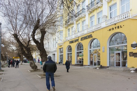 Feodosia, Crimea, Russia - March 08, 2019: People on the Avenue. Aivazovsky near the Grand cafe Denikin and the Grand Hotel Astoriaのeditorial素材