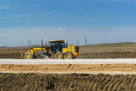 The alignment of the next layer of the road with a bulldozer. Construction of the highway Tavrida in...
