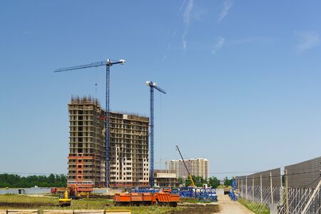 Construction of a monolithic apartment building consisting of columns and ceilings. The lower floors...