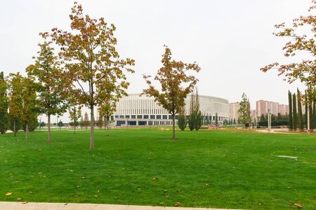 Krasnodar, Russia-October 19, 2019: Krasnodar football club Stadium on a cloudy autumn day. Green lawn with trees in the Park of the Galician. Weekend in townのeditorial素材