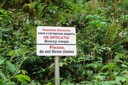 A sign near the cliff, forbidding throwing down stones and other objects in the yew-Box grove. The...
