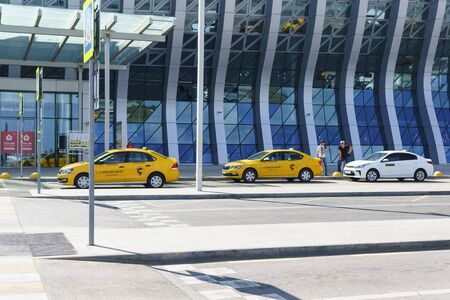 Simferopol, Crimea, Russia-September 13, 2019: Yellow taxi cars parked near Simferopol airport