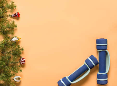 Holiday greetings and gift sports equipment. Fitness after long holidays and feasts