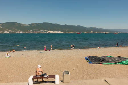 Russia, Novorossiysk, July 11, 2020: Central beach of the black sea city. Citizens and guests relax on a Sunny summer dayのeditorial素材