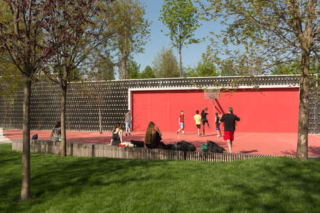 Krasnodar, Russia-may 02, 2021: On a sunny day, a group of teenagers plays basketball on a...