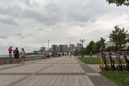 Novorossiysk, Russia, August 14, 2021: New embankment named after Admiral Serebryakov near the monument to the Unknown Sailor. Residential new buildings in the backgroundのeditorial素材
