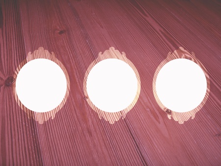 Three white spaces in wood frames in desaturated oldish pinksの写真素材