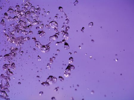 Calming violet background with water drops