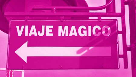 Magical trip sign in spanish with an arrowの写真素材