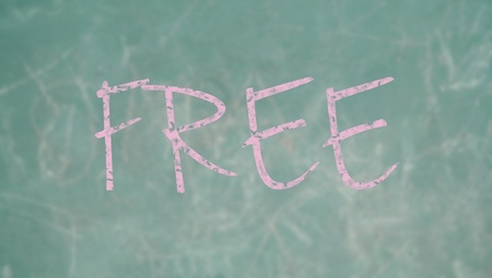 Free word written with chalk on a green blackboardの写真素材