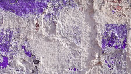 Textured abstract background of a rustic white wall with violetの写真素材