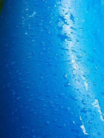 Cyan blue artificial texture wet background with dropsの写真素材