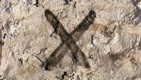 X mark spray on silver textured wall abstract backgroundの写真素材