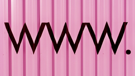 Internet domains letters www and the dot in black on pink backgroundの写真素材