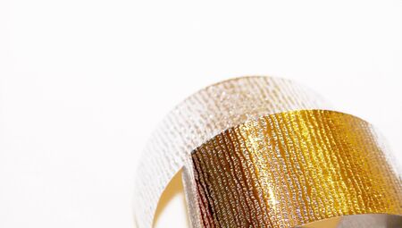 Silver christmas ribbon close up isolated on white background with copyspace