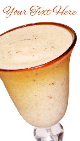 Creamy smoothie glass with text space on whiteの写真素材