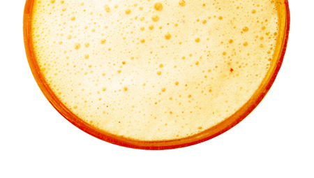 Pineapple yellow orange juice glass close up isolated on white backgroundの写真素材