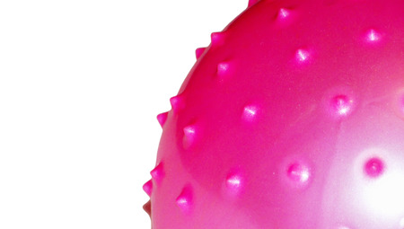 Pilates pink ball texture close up isolated on white backgroundの写真素材