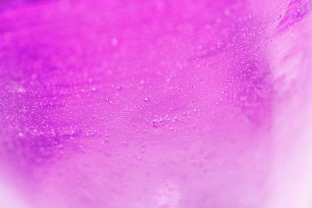 Magenta glass background with small bubblesの写真素材