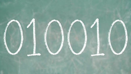Binary code numbers of chalk green blackboard backgroundの写真素材