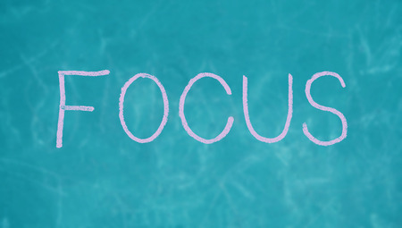 Focus concept word of chalk on blue backgroundの写真素材